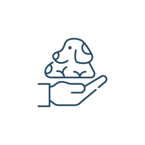 a hand holding a dog in its hand